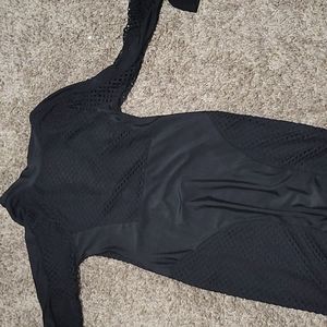 Black dress above the knees, stretch but fits tight if you have a full body shap